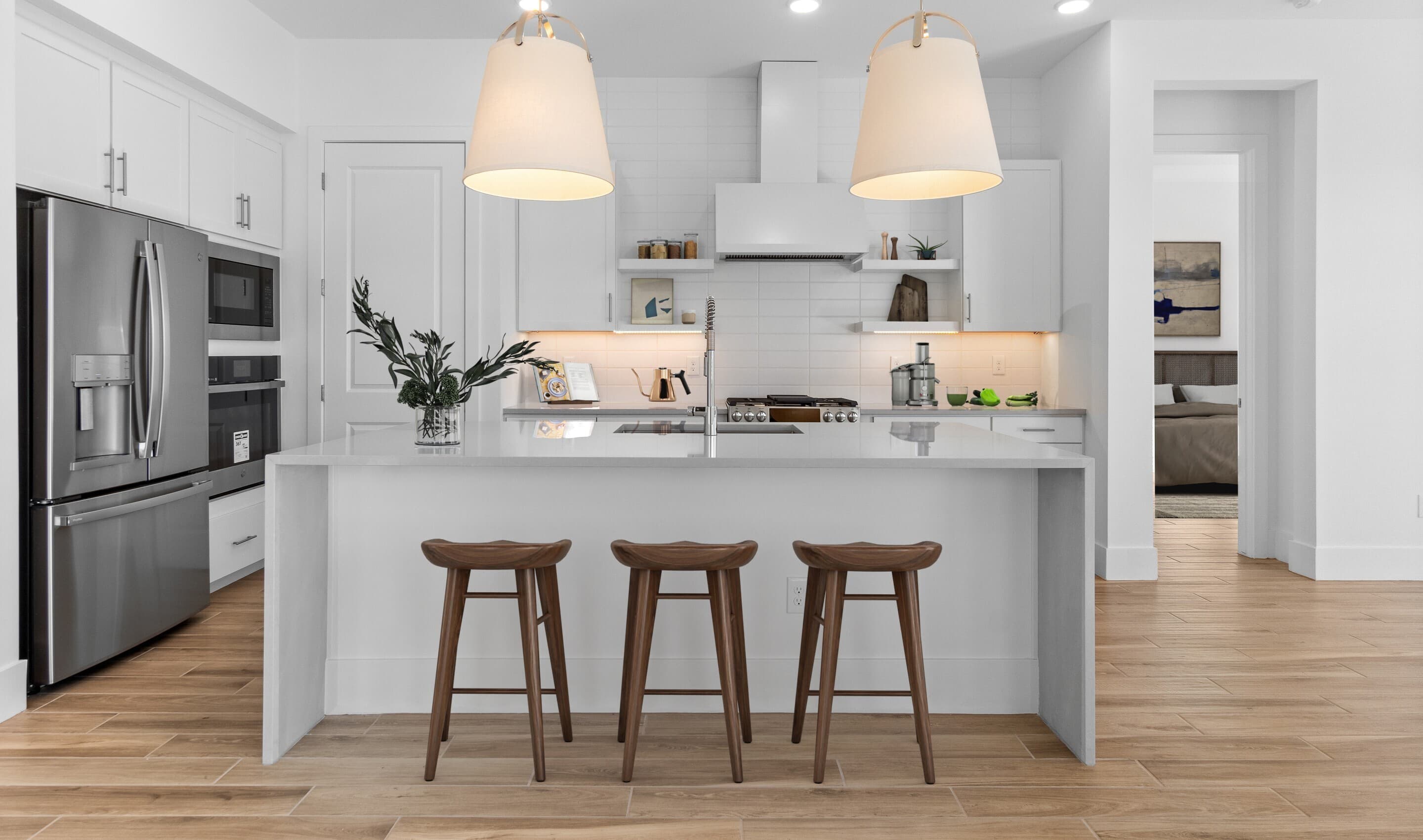 Kitchen with pendant lighting and full height-backsplash